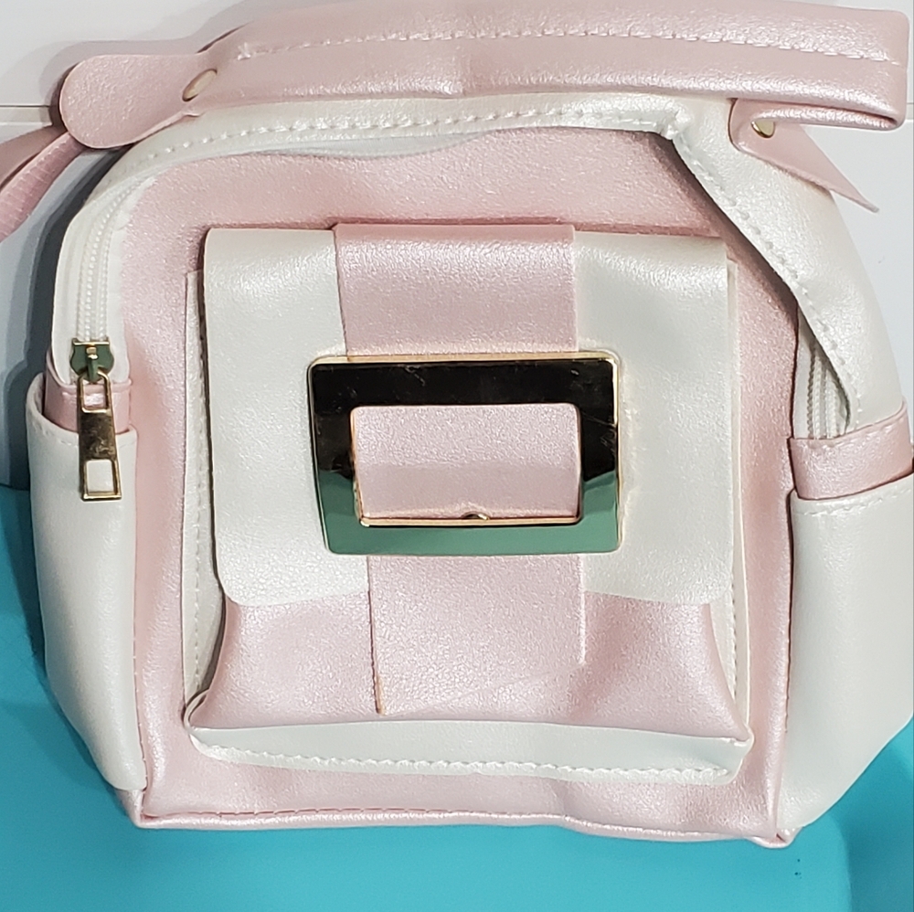 Chic Pink and White Backpack with Structured Design